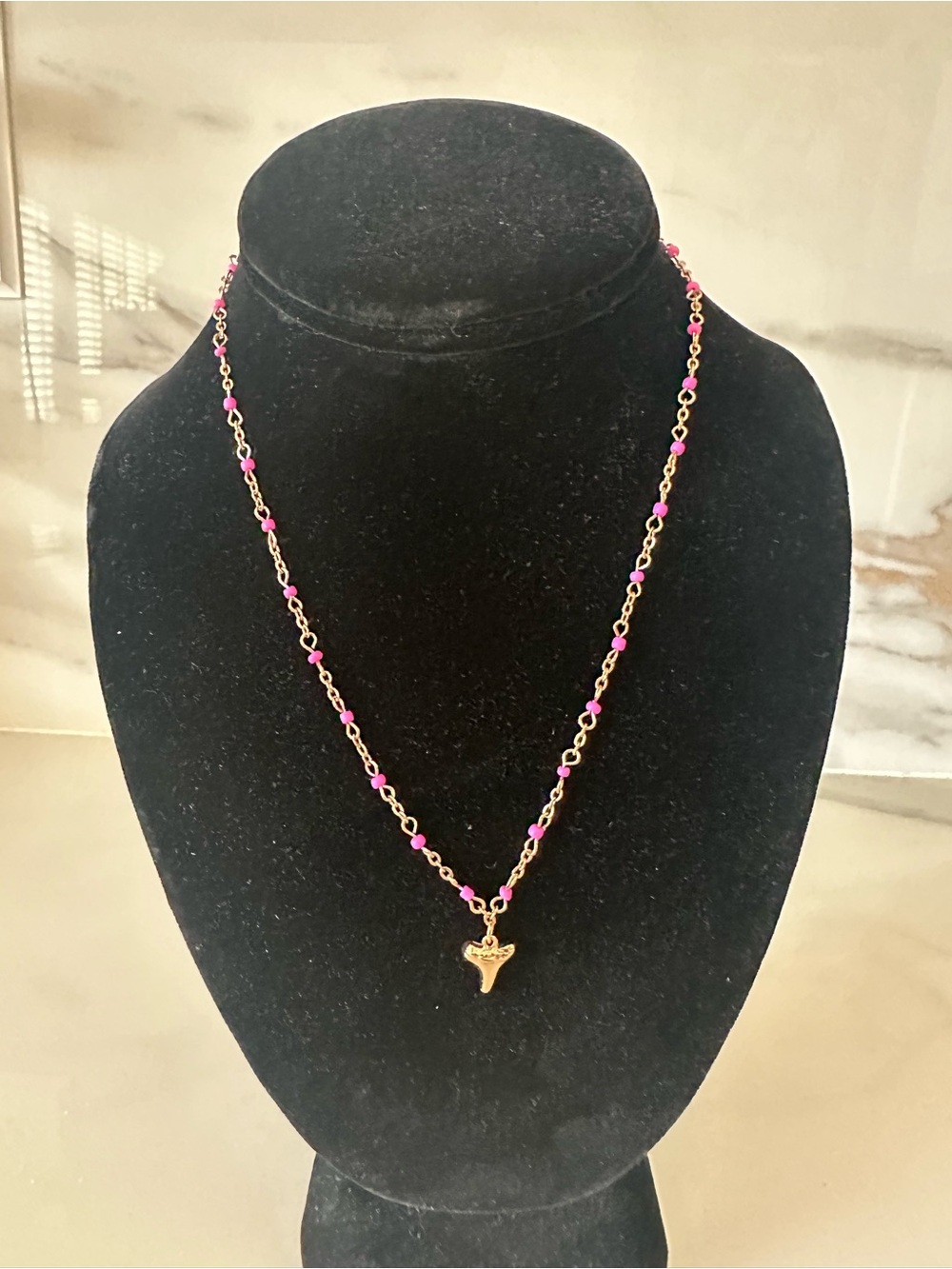 Gold Tone Necklace with Pink Beads and Shark Tooth Pendant